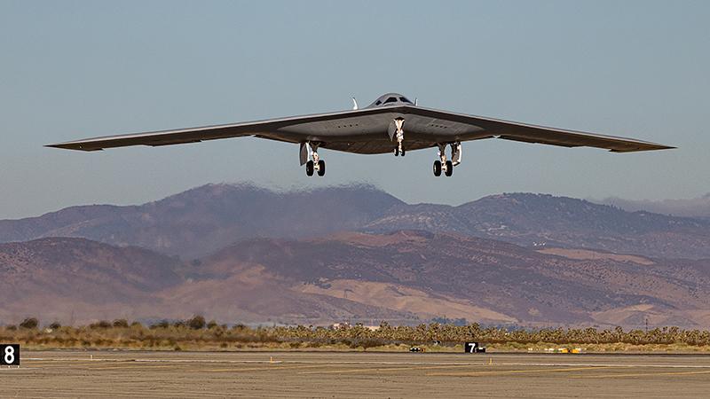 B-21 flying just above ground