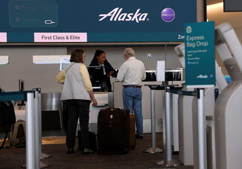Alaska Airlines employee and passengers
