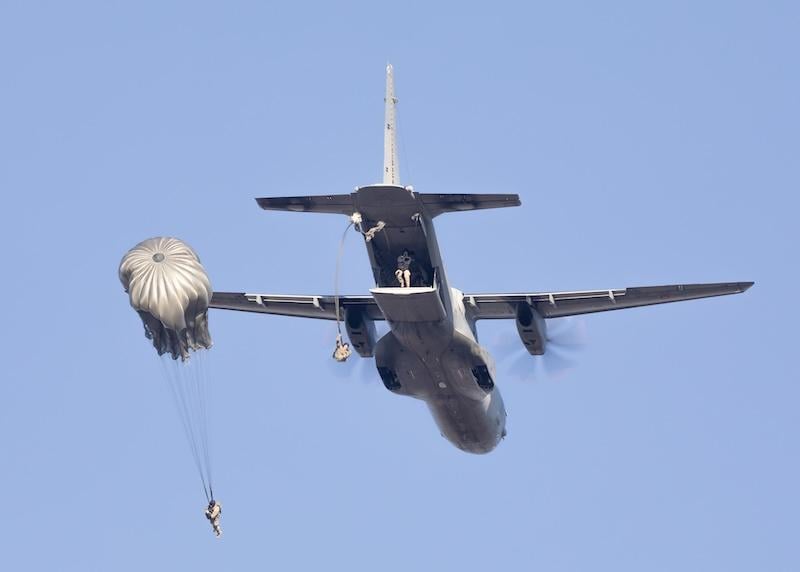 paratroopers jumping out of aircraft