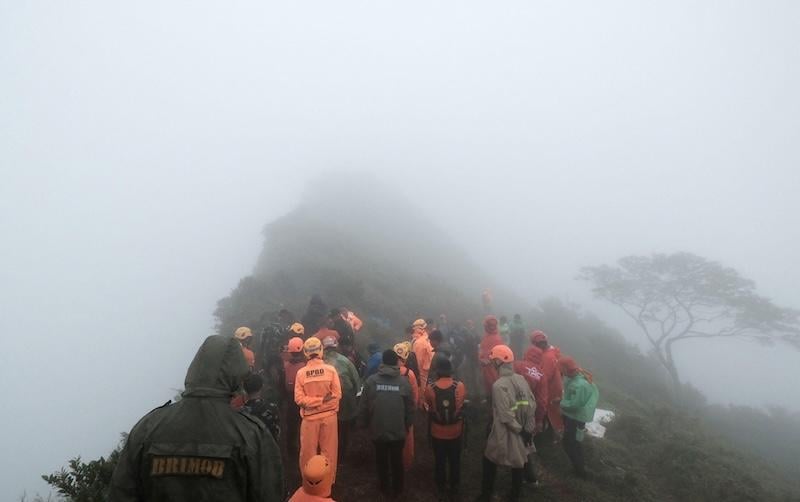 rescue personnel at site of ATR crash in indonesia