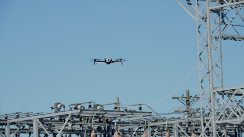 An American-made Skydio X10 drone inspects utility lines. 