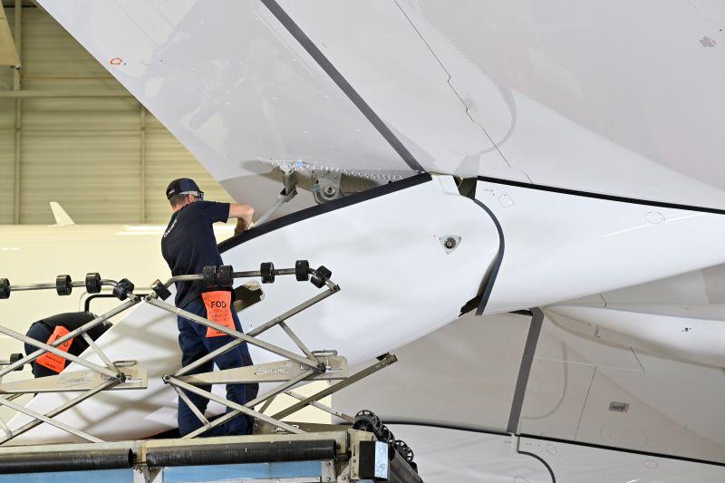 Daher employee and an aircraft