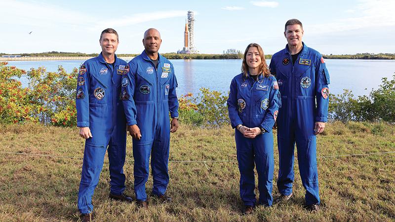 four astronauts standing