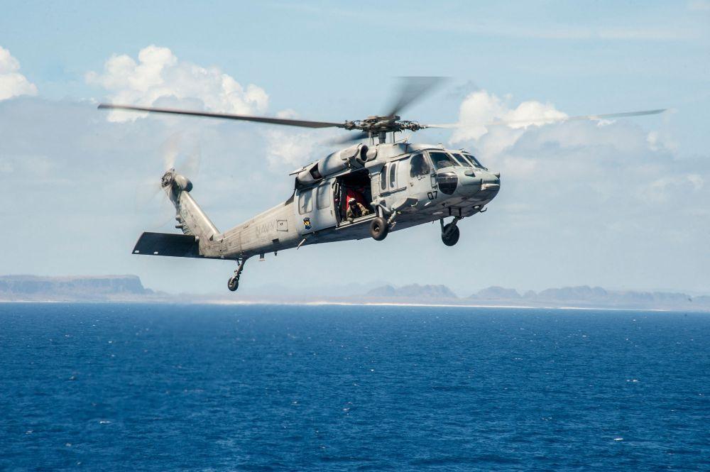  MH-60R Seahawk helicopter from the Saberhawks of Helicopter Maritime Strike Squadron (HSM) 77 prepares to land on the aircraft carrier USS George Washington (CVN 73) after delivering fresh water to the Republic of the Philippines in support of Operatio Contributor: MixPix