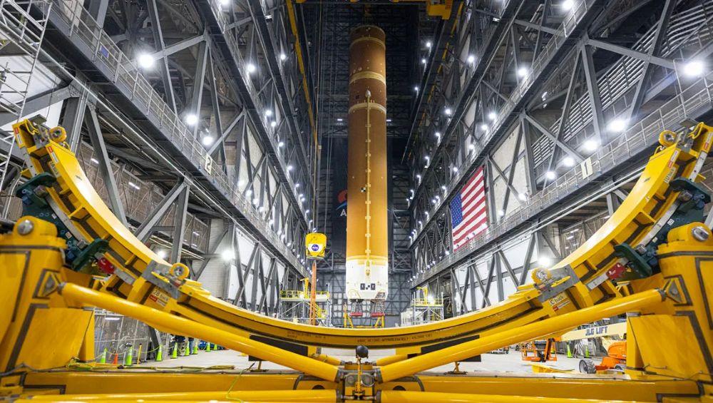 A crane lifts to vertical the Space Launch System Moon rocket for Artemis II on Saturday, March 22, 2025, inside the Vehicle Assembly Building at NASA’s Kennedy Space Center. NASA/Frank Michaux