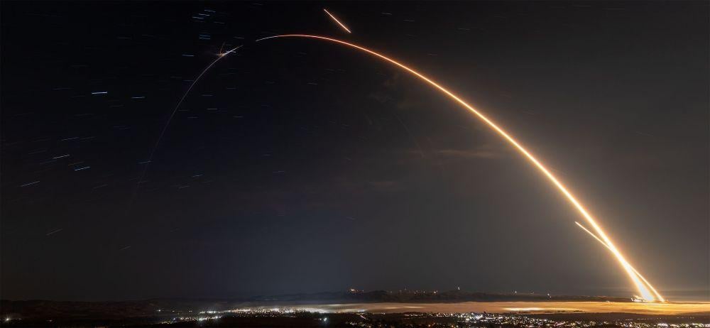 A long exposure shot of SpaceX launching the National Reconnaissance Office’s NROL-105 mission on a Falcon 9 rocket on Jan. 16. 2026, from Vandenberg SFB, California, and the return of the booster following stage separation. Credit: SpaceX