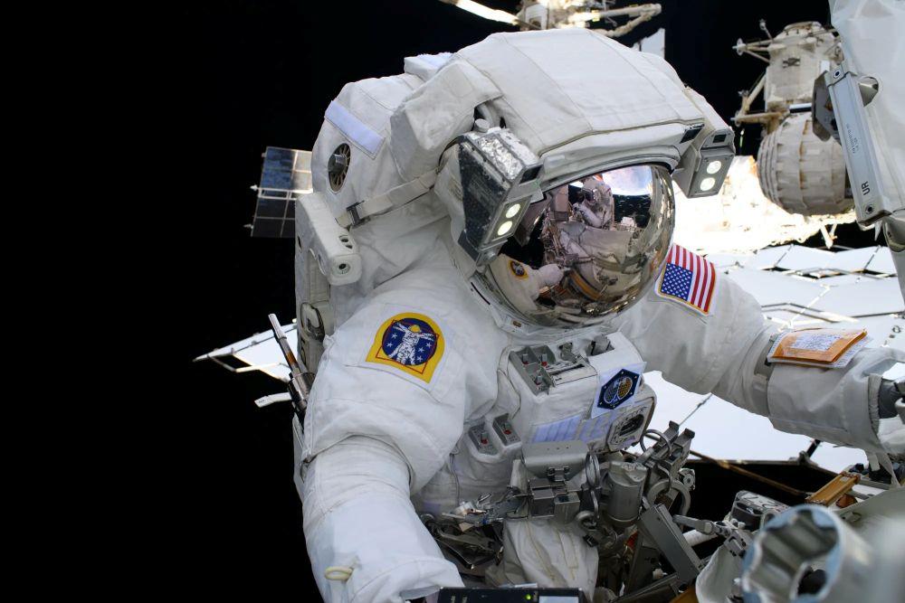 NASA astronaut and Expedition 72 Flight Engineer Nichole Ayers is pictured during a spacewalk to upgrade the orbital outpost’s power generation system and relocate a communications antenna.