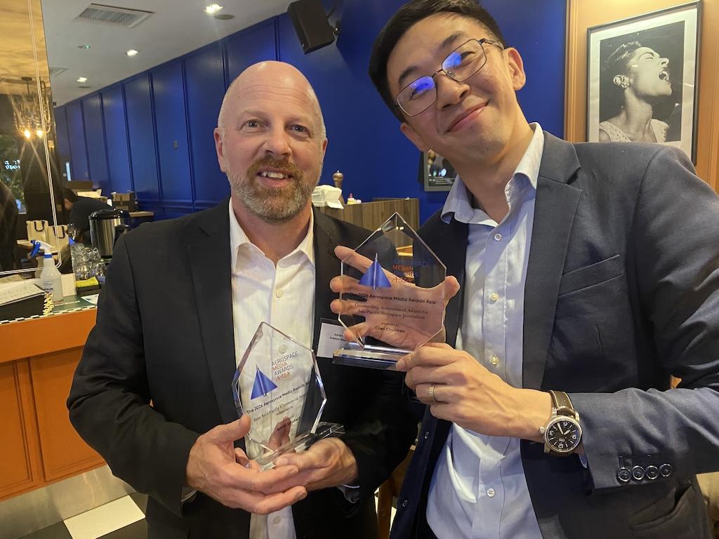 Adrian Schofield (left) and Chen Chaunren with their Aerospace Media Awards trophies.