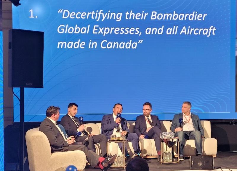 Corporate Jet Investor London panelist on stage