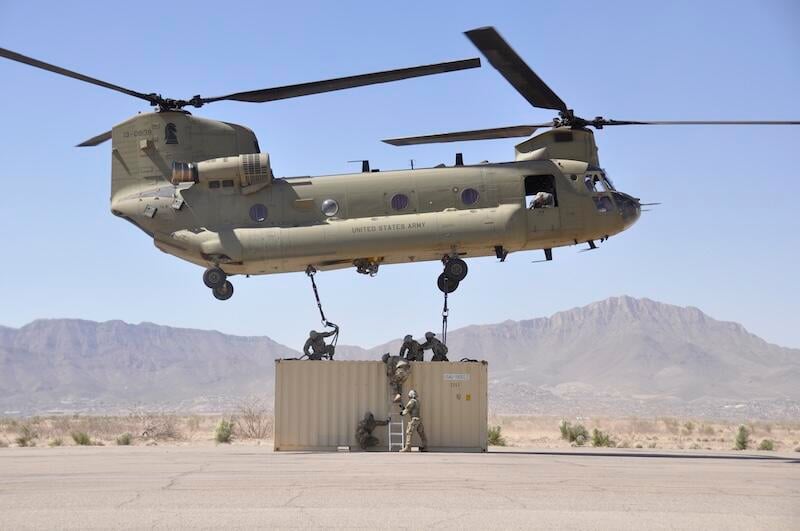 Soldiers attached a Conex box to a CH-47 Chinook. 