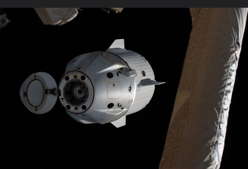 The SpaceX Dragon backs away from the International Space Station