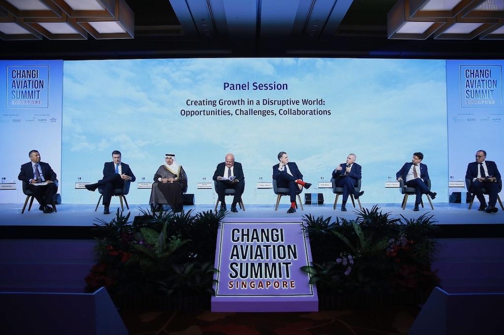 Simon Hocquard (first from right) sits on stage at the Changi Aviation Summit.