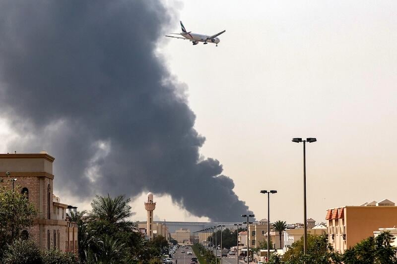 emirates aircraft approaching dubai airport after drone strike hit fuel tank near the airport