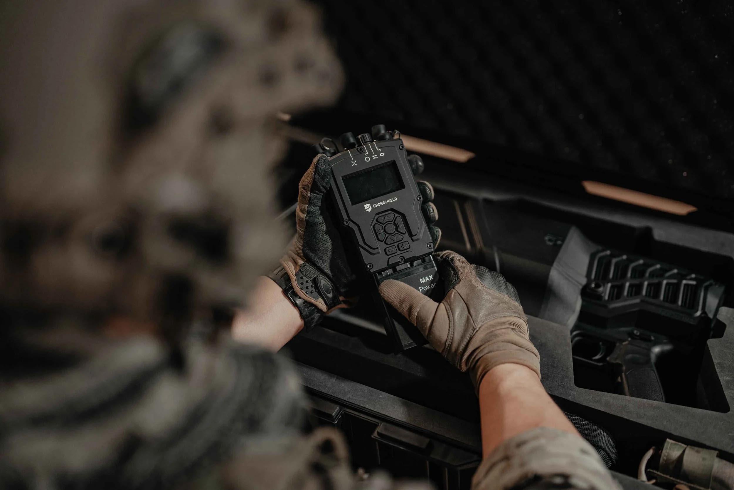 droneshield tech in soldier's hand