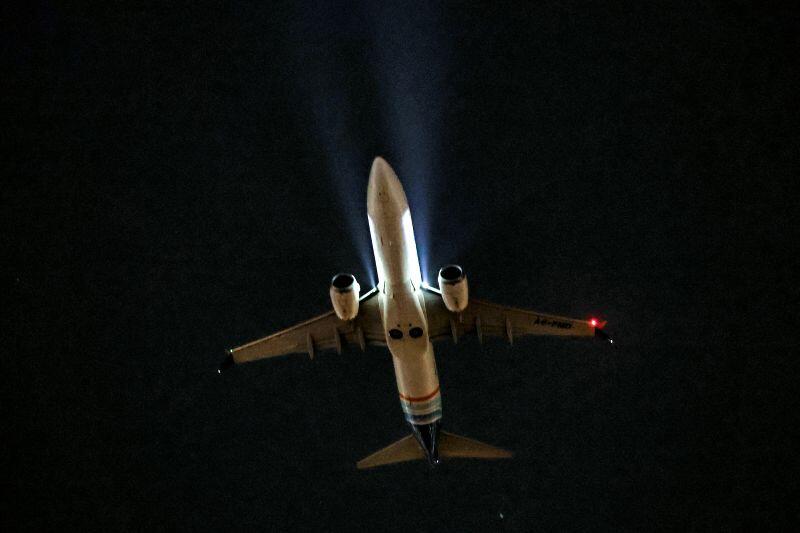 Flydubai aircraft inflight with dark background