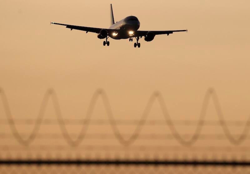 plane landing at sunset