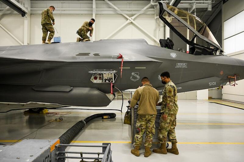 four air force maintainers working on F-35