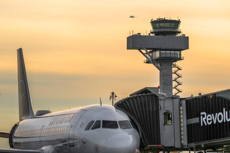 Lufthansa aircraft at Berlin Airport at sunset