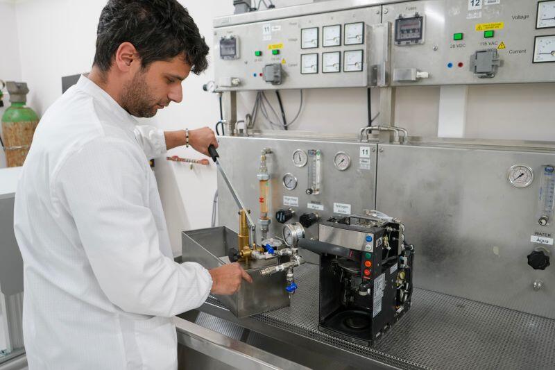 employee with coffee maker