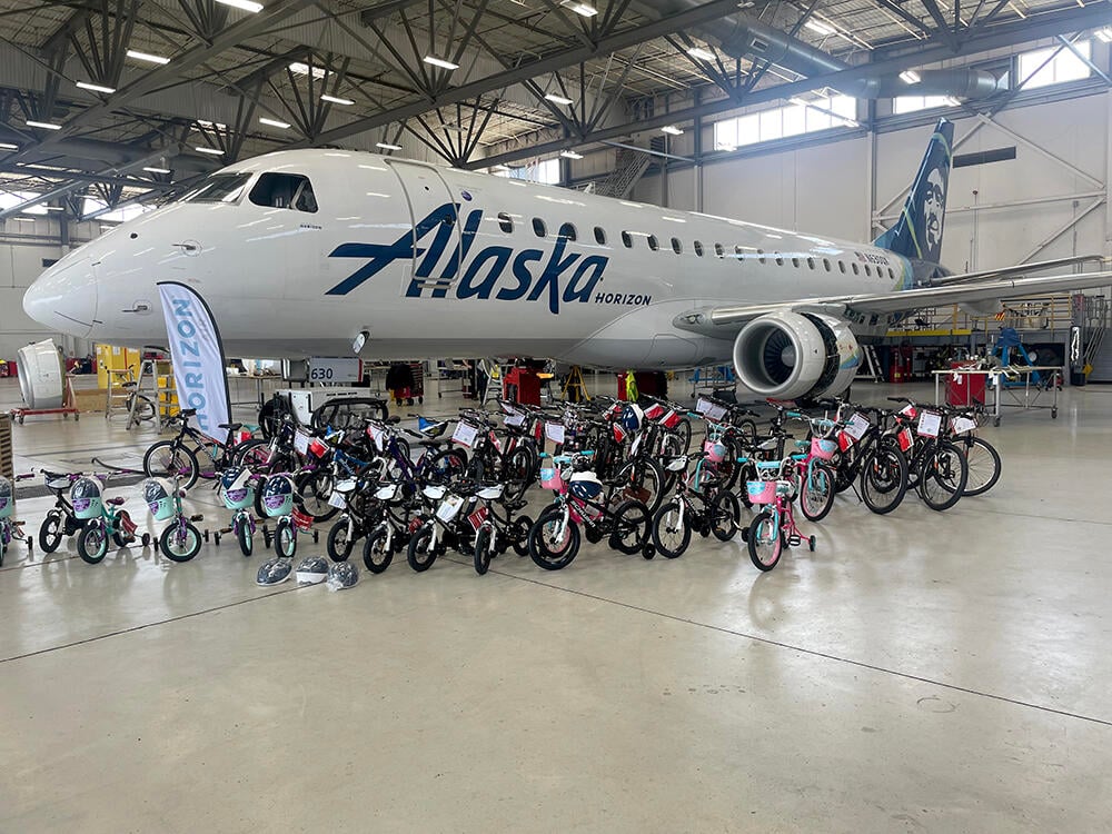 Horizon Air aircraft in the hangar with bikes in front of it