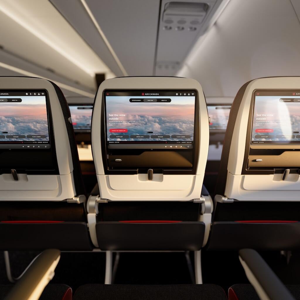 A seatback display showing Panasonic Avionics' Astrova IFEC system on an Air Canada aircraft.