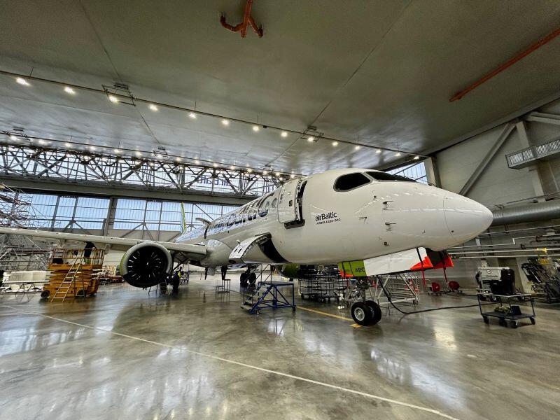 airBaltic aircraft in a hangar