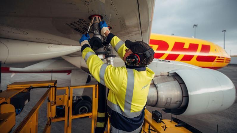 DHL Express aircraft and employee