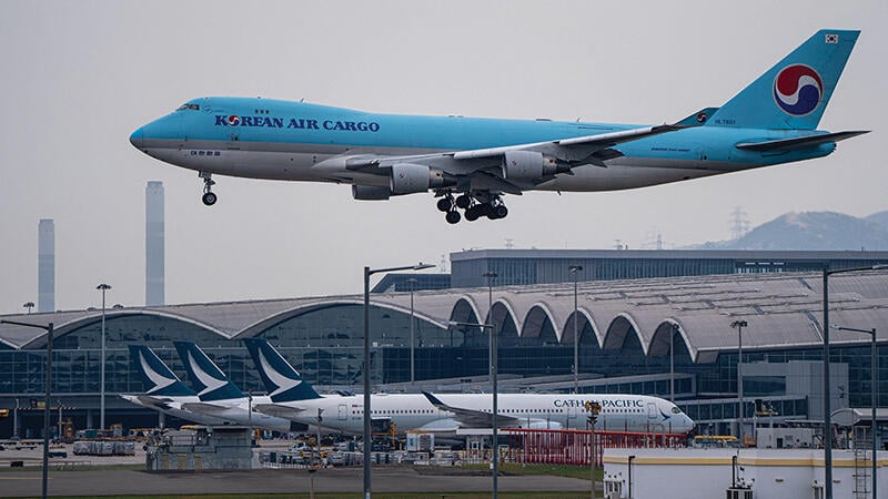 Korean Air Cargo aircraft descending for landing at Hong Kong International Airport