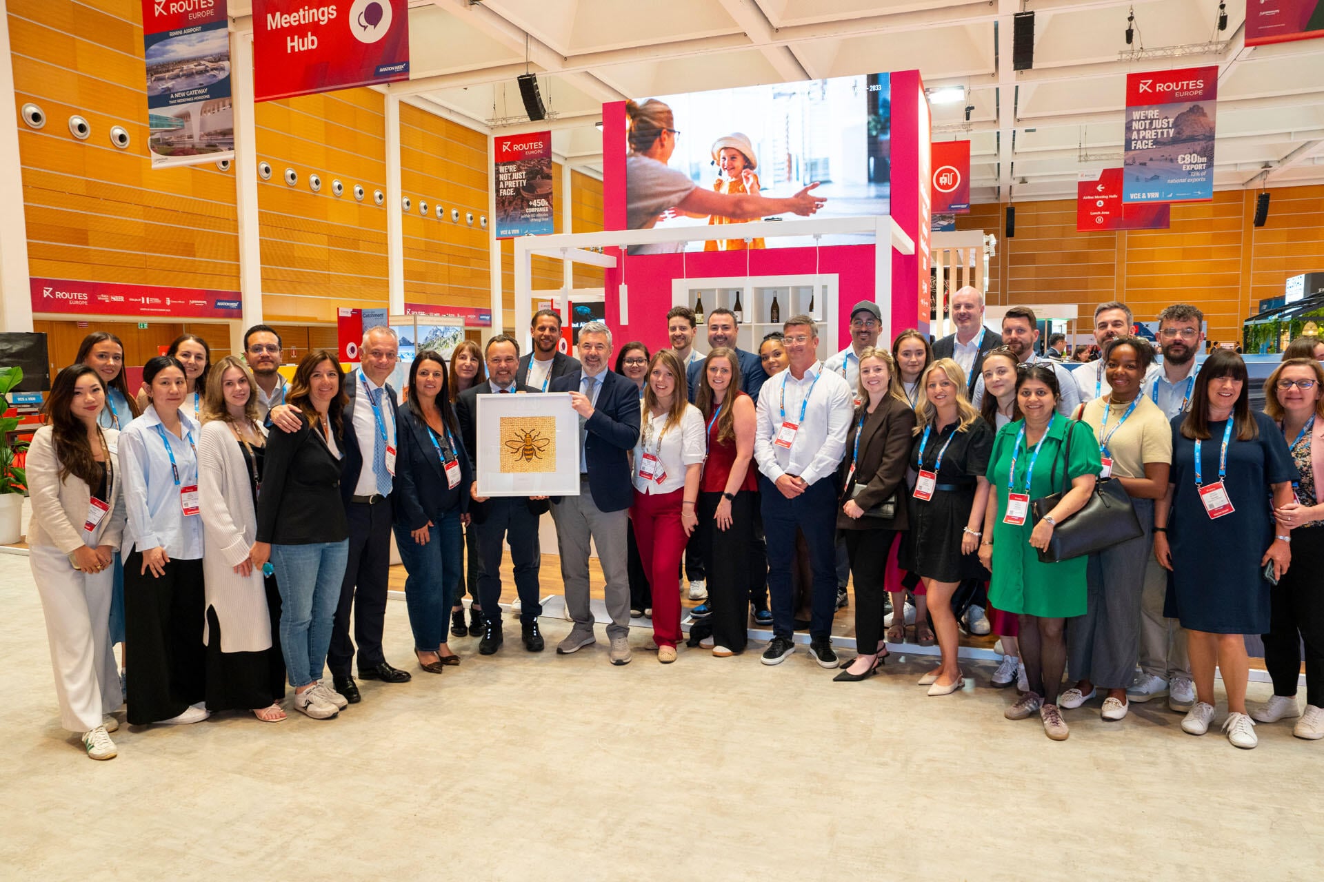 A gift giving ceremony between Routes and stakeholders from the Emilia-Romagna Region, the Municipality of Rimini, and Rimini and San Marino International Airport