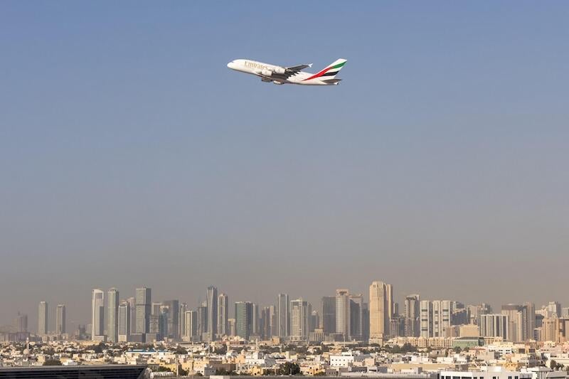 emirates jet flying above uae