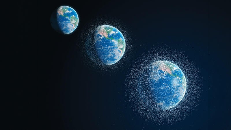 concept image of Earth being surrounded by increasing numbers of satellites