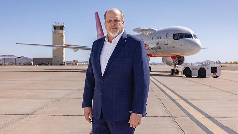 Jim Currier standing in front of Honeywell Aerospace Boeing 757