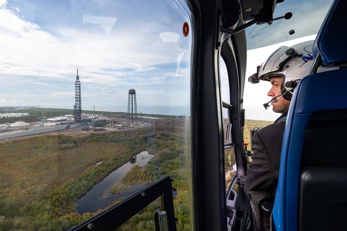 Isaacman in helicopter surveying Cape Canaveral SFS SLC-36 