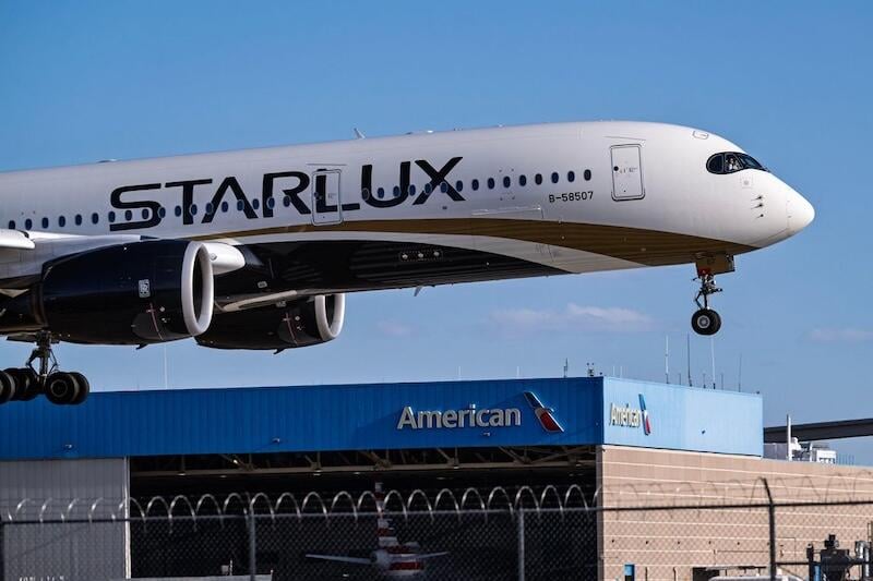 Starlux A350 over American hangar