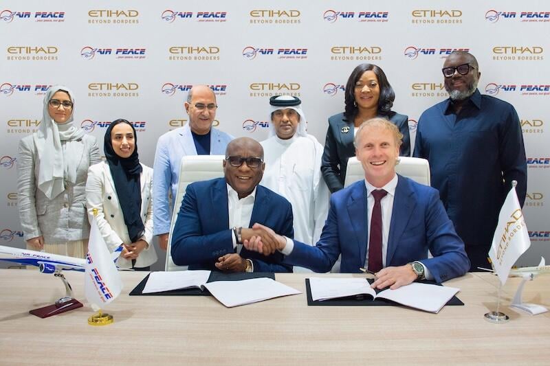 officials at etihad-air peace signing
