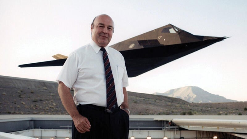 Denys Overholser in front of F-117