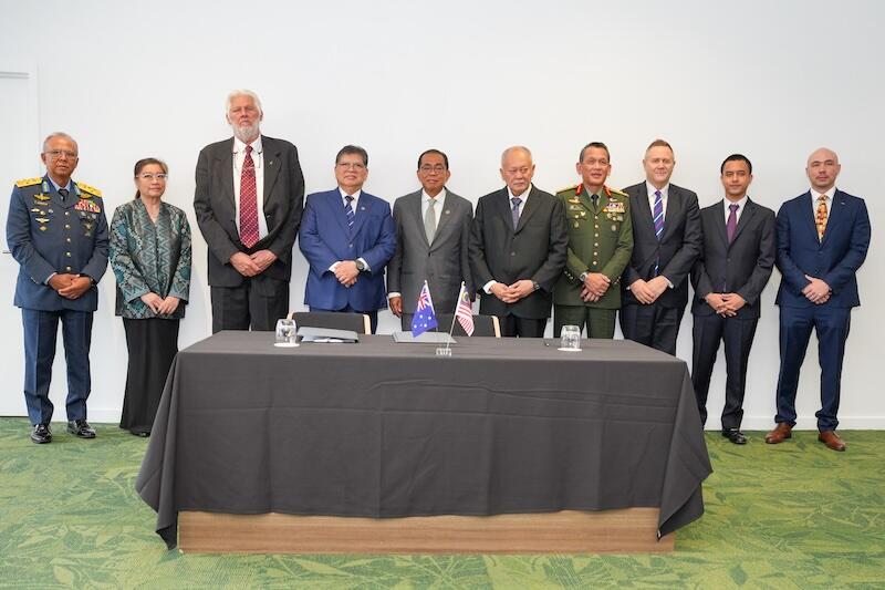 officials at malaysia/australia space JV signing ceremony