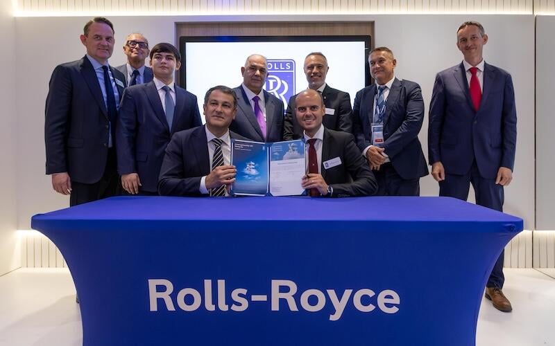 Rolls-Royce and Somon Air officials pose after signing the Trent 1000 XE agreement at Farnborough