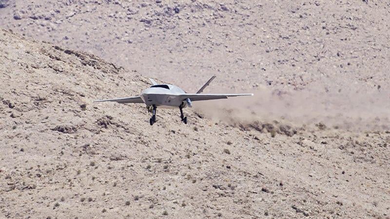 YFQ-42 coming in for a landing in desert environment
