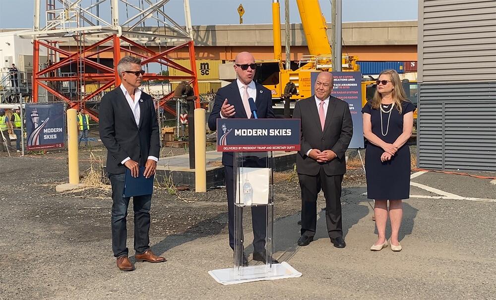 Bryan Bedford speaks during surface movement radar unveiling