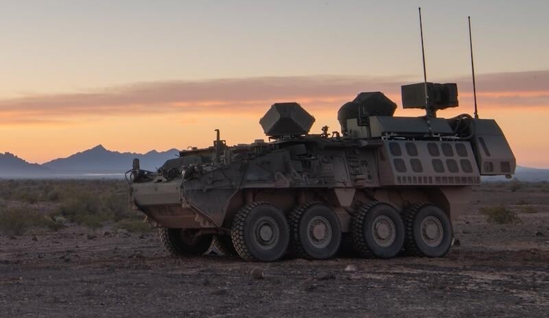 armored military vehicle in desert landscape