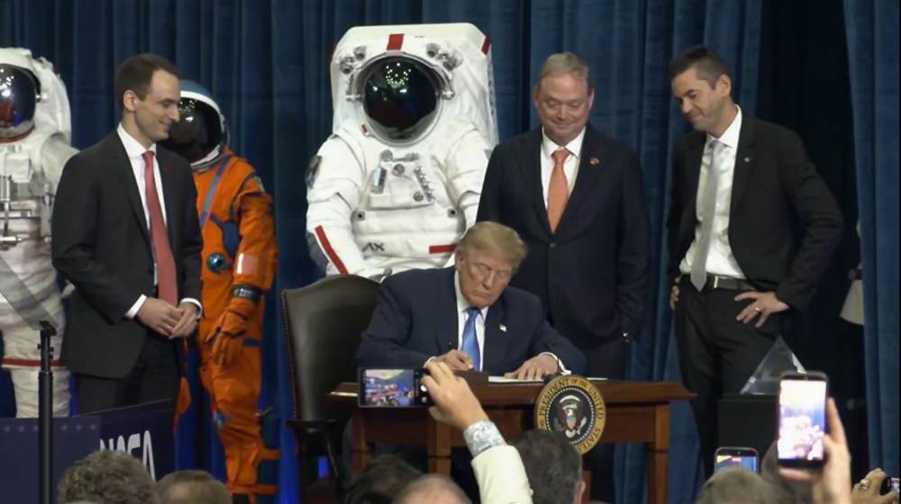 President Trump signs the order.