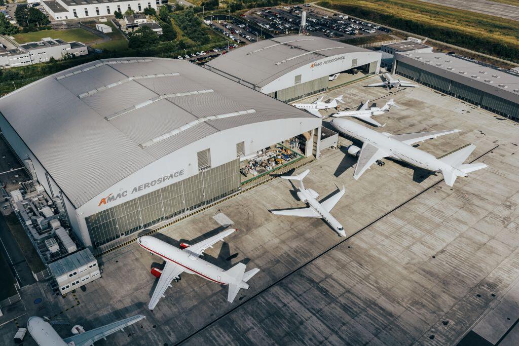 Airplanes parked outside AMAC hangers