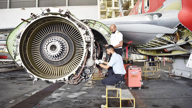 MAB Engineering Services aircraft maintenance engineers performing inspection and servicing work on a turbofan
