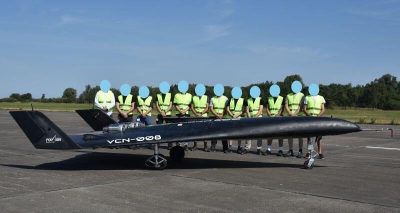 grounded polaris spaceplane in front of team members