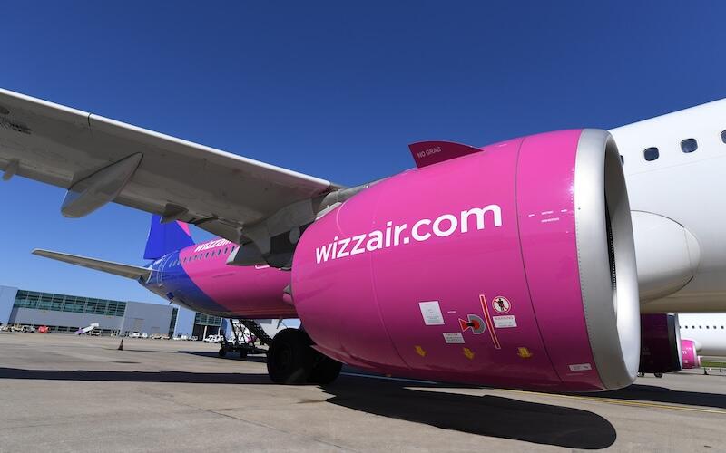 close-up of wizz air plane engine and wing