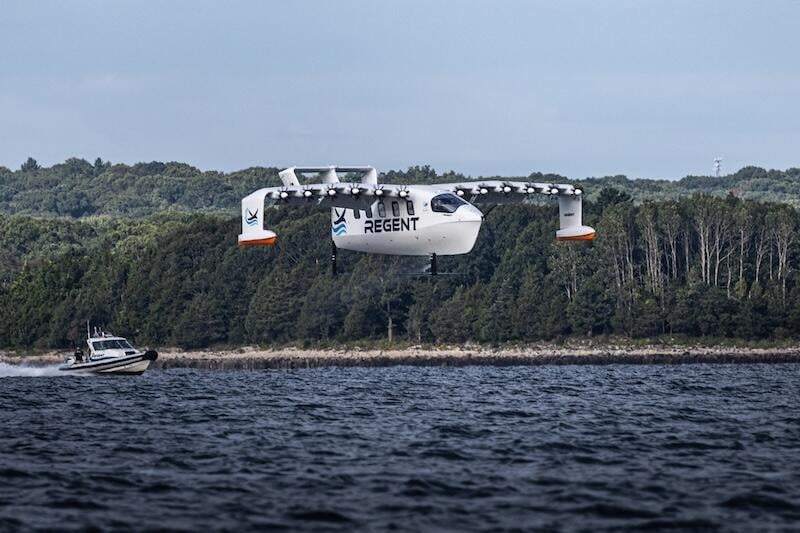 regent seaglider flies low over water