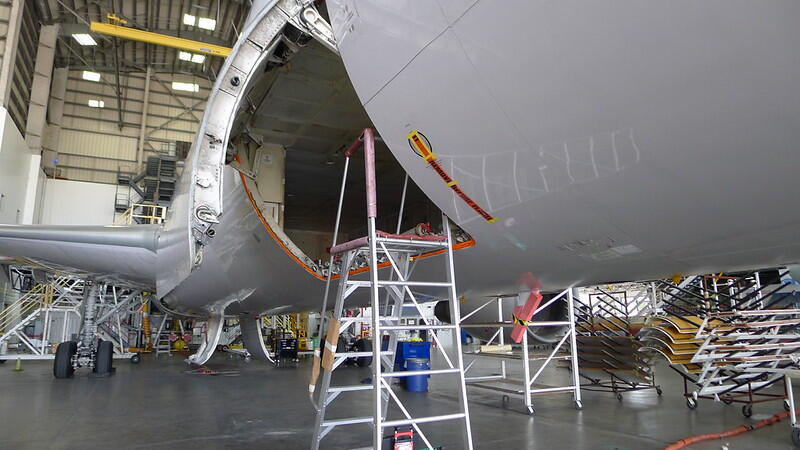 aircraft in hangar undergoing repair