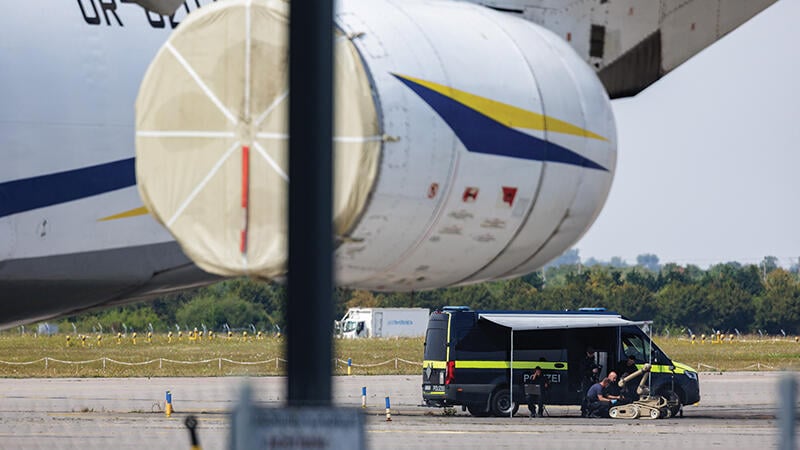 police with explosive disposal robot next to Ukrainian cargo plane