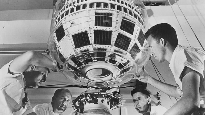 people working on Telstar 1 communications satellite